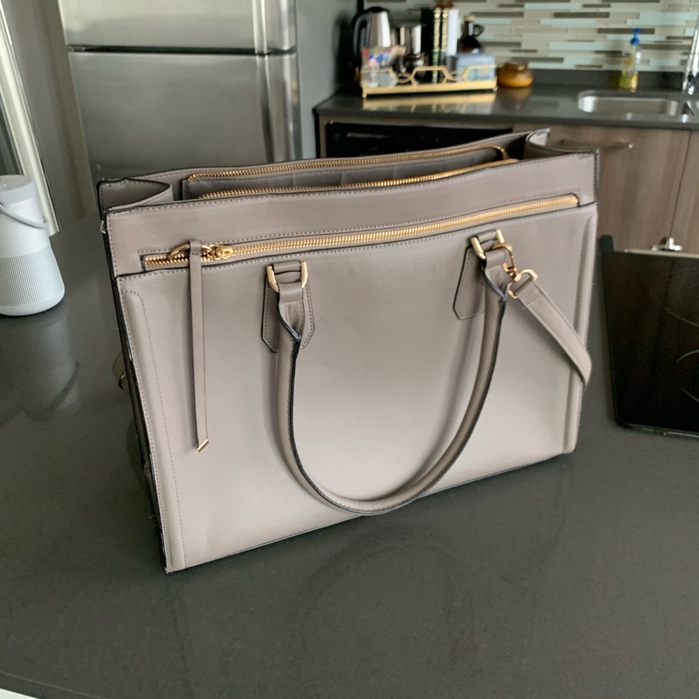 Beige leather purse with crossbody shoulder strap